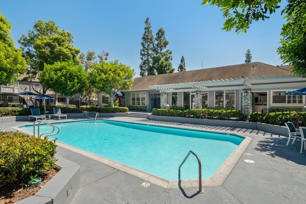 a swimming pool with a building in the background