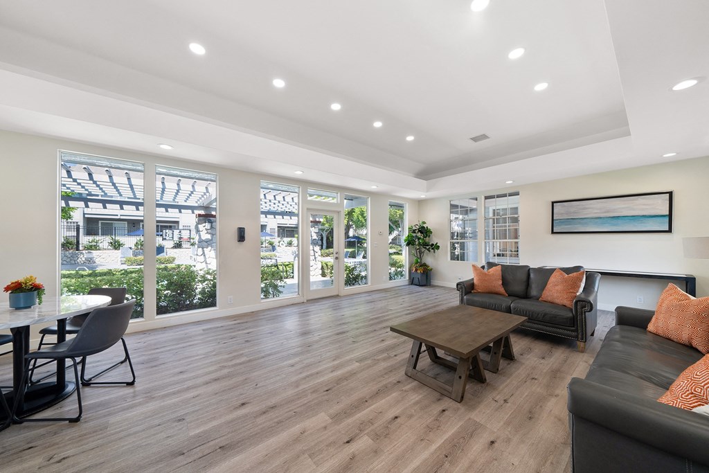 a living room with a couch and a table and chairs