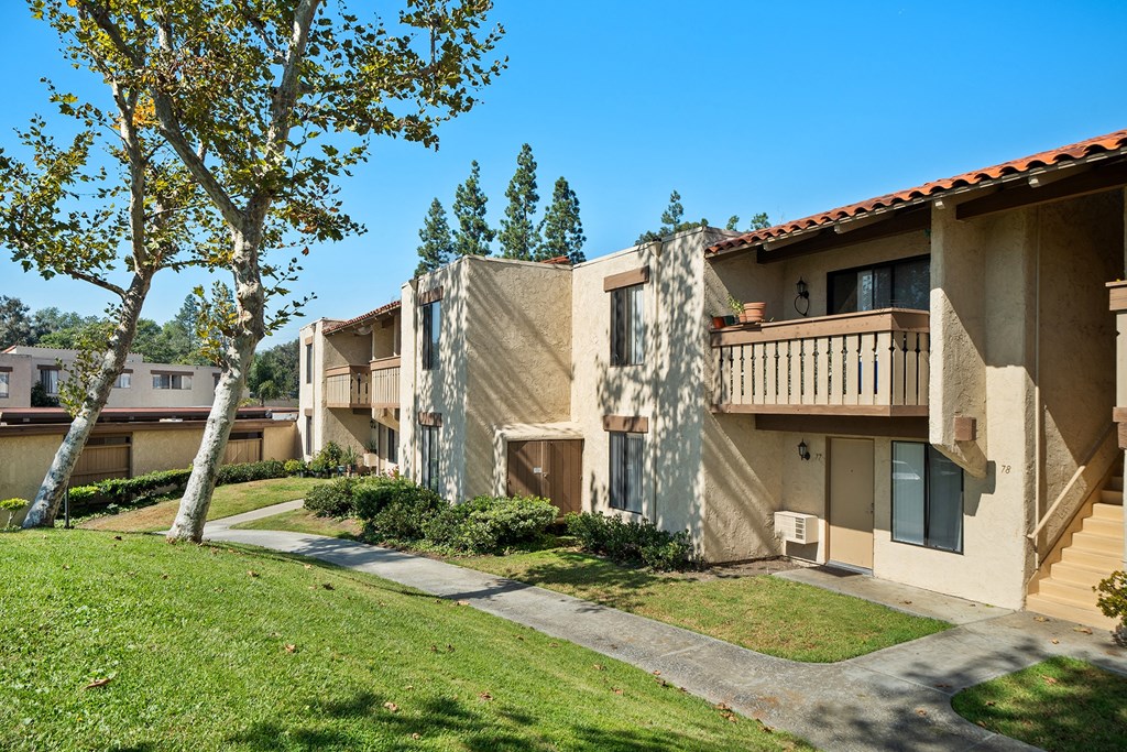 the view of the balconies of an apartment building on a sunny day