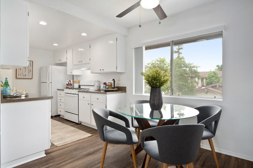 a kitchen and dining area in a 555 waverly unit
