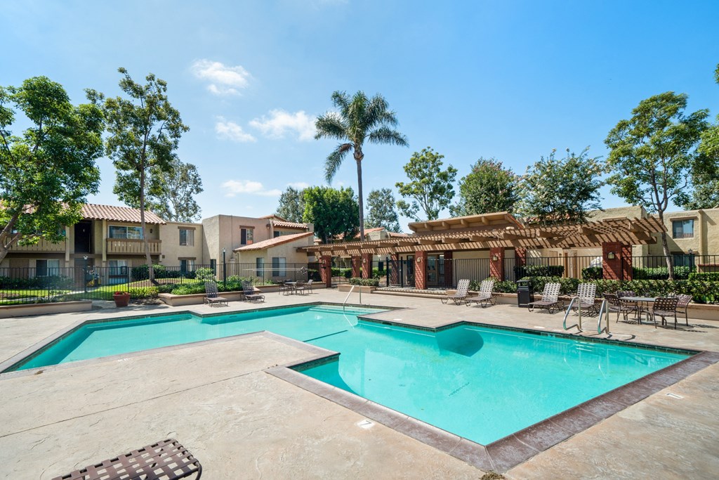 our apartments have a swimming pool and a patio with chairs
