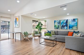 a living room with a couch and a table