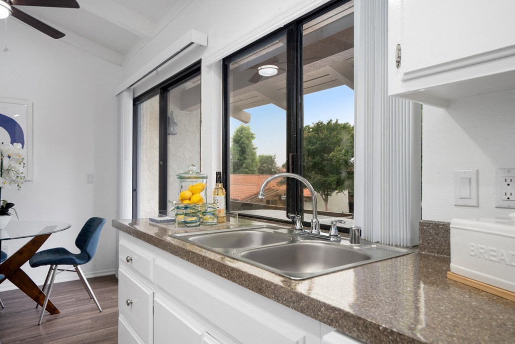 a kitchen with a sink and a window