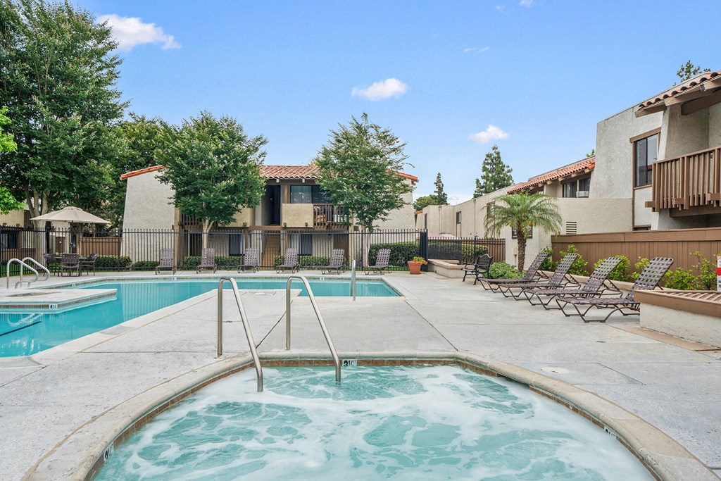 our apartments have a resort style pool and lounge chairs