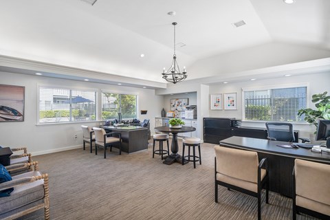 the preserve at ballantyne commons clubhouse with dining area and living room
