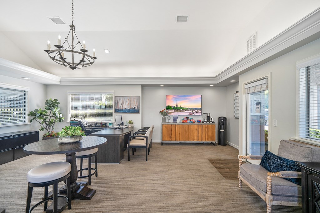 a living room with a kitchen and a dining room