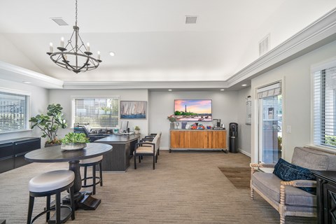 a living room with a kitchen and a dining room