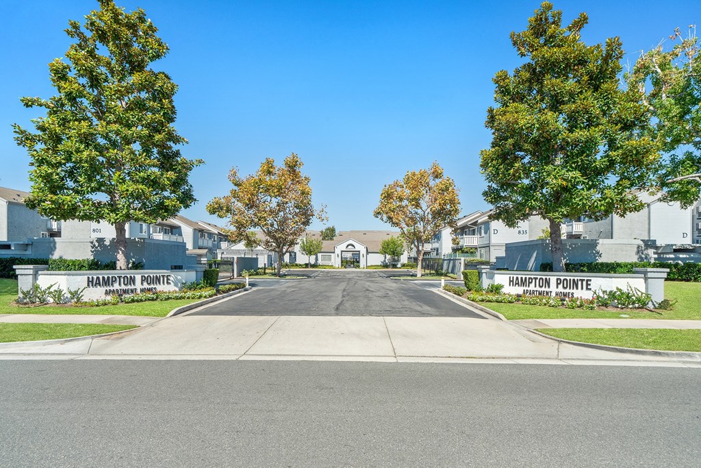 a street with houses and trees on either side of a road