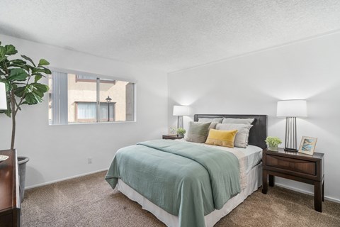our apartments offer a bedroom with a bed and a window