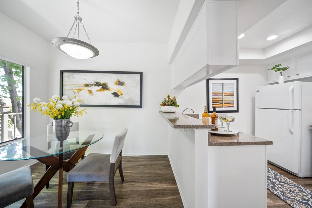 a kitchen and dining area in a 555 waverly unit