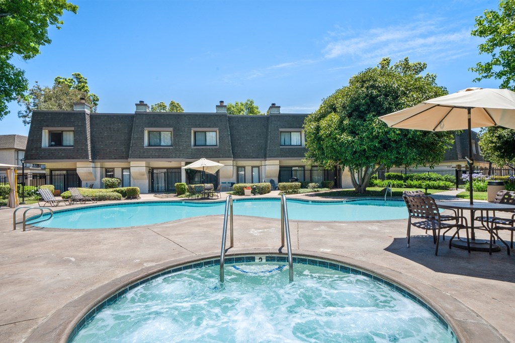 our apartments have a resort style swimming pool with umbrellas