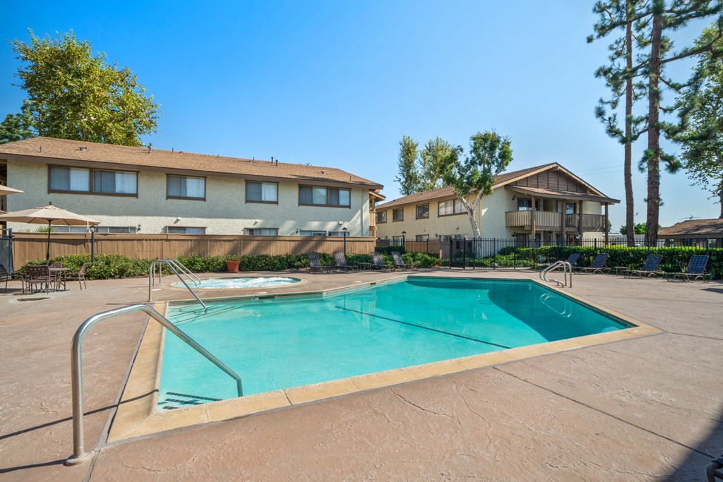 our apartments have a swimming pool and a patio with umbrellas