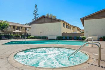 our resort style hot tub is next to our building with a pool
