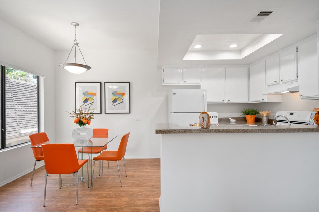 a kitchen and dining area in a 555 waverly unit