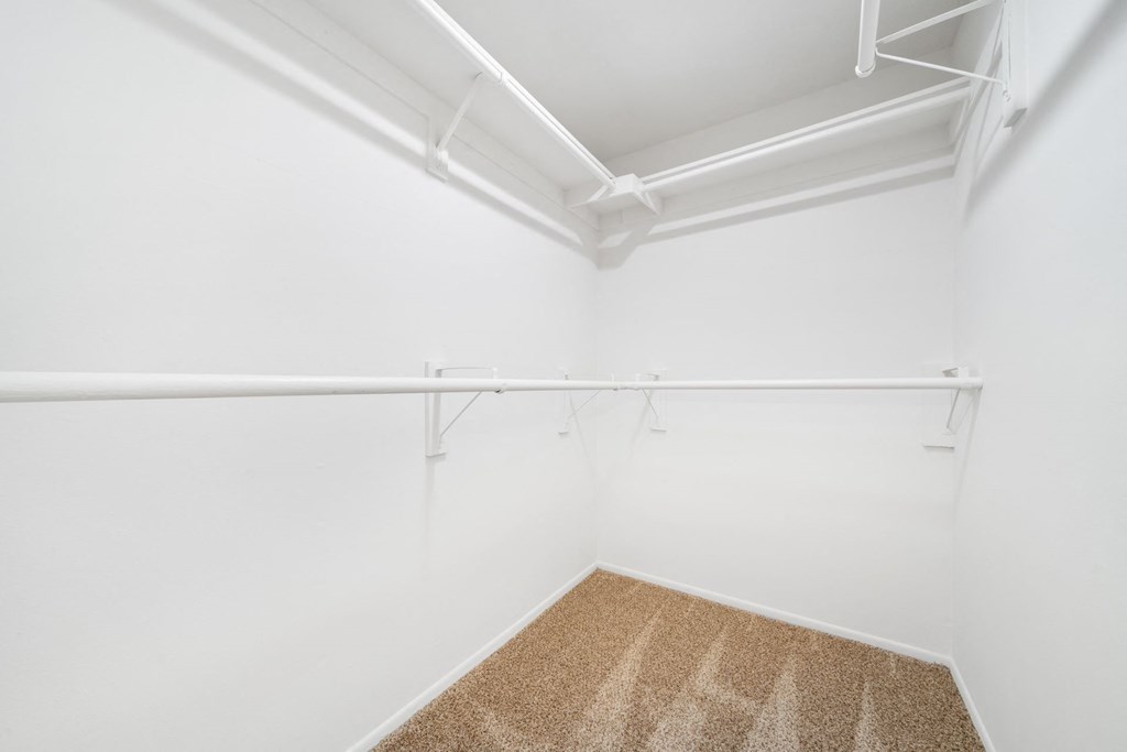 a spacious walk in closet in a 555 waverly unit