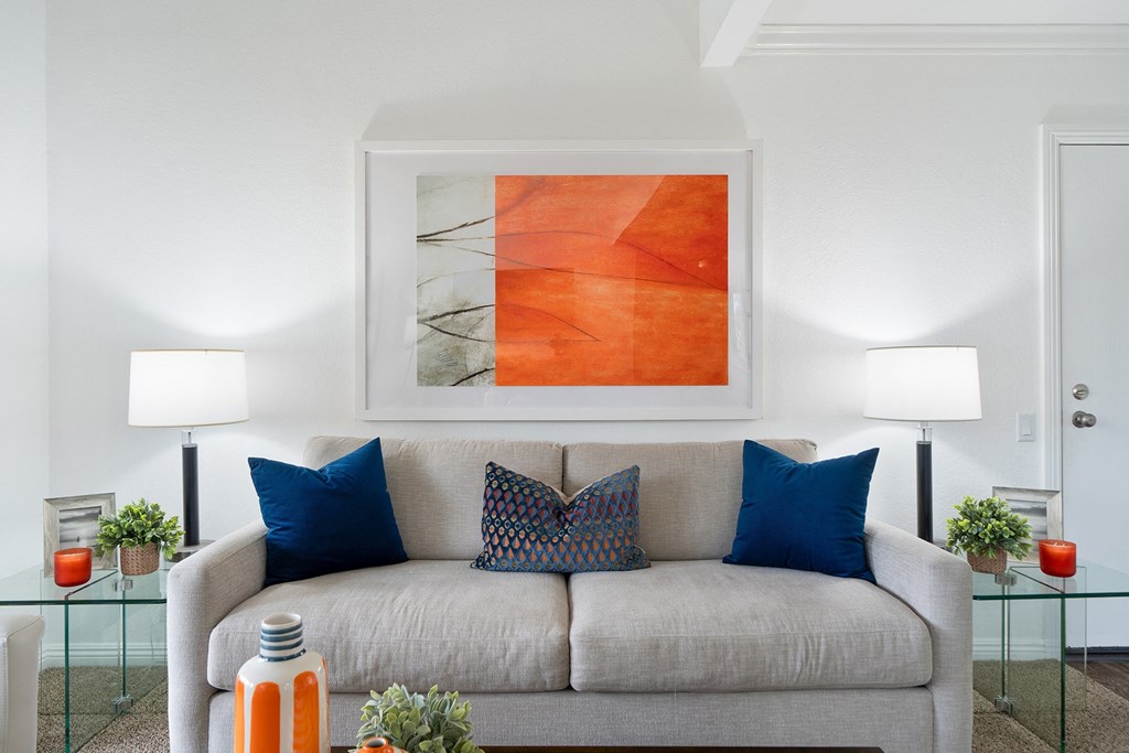 a living room with a couch and pillows