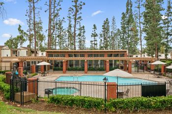 our apartments have a large pool and a courtyard with umbrellas