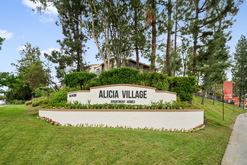 the sign for alta village at the entrance of the park