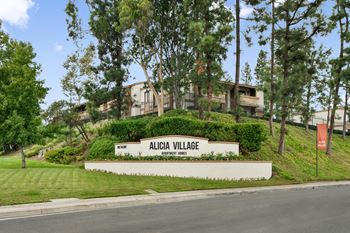 the sign for alchemy village at the end of the street