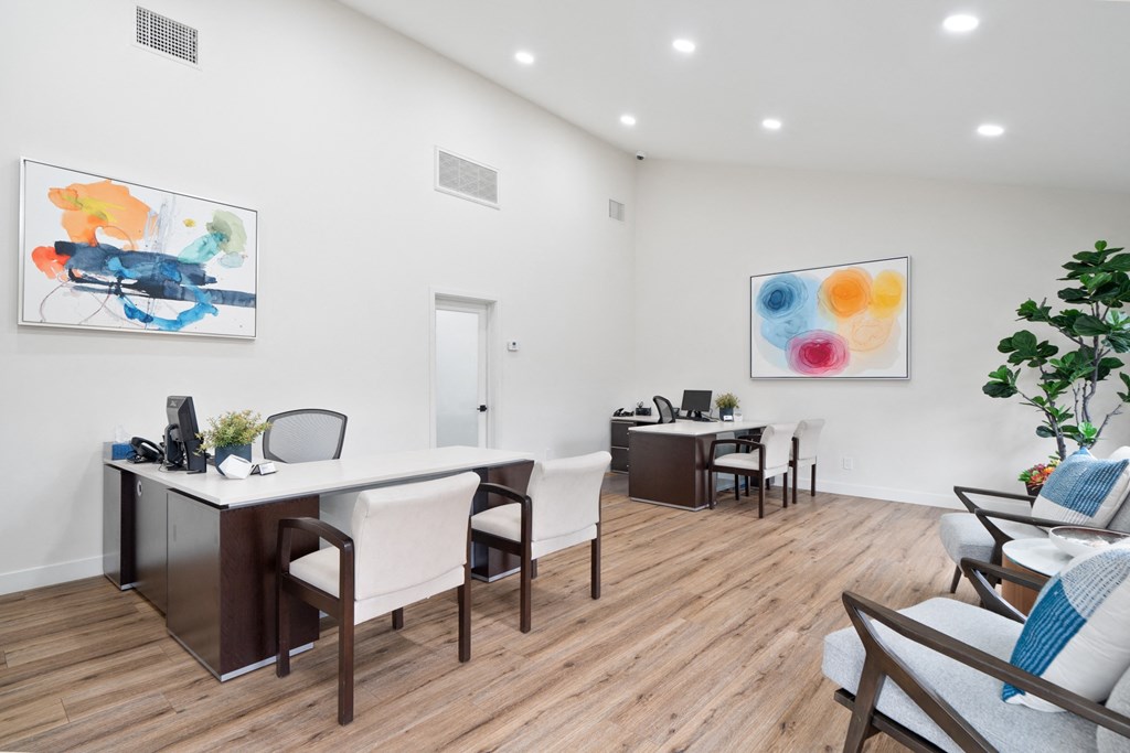 an open living room with a dining room table and chairs