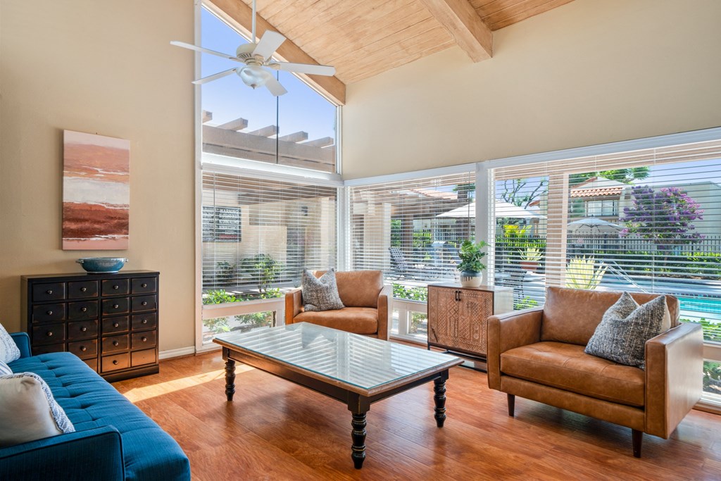 a living room with couches and chairs and a coffee table