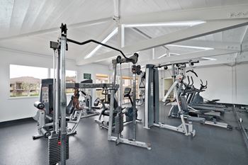 a gym with weights and other exercise equipment