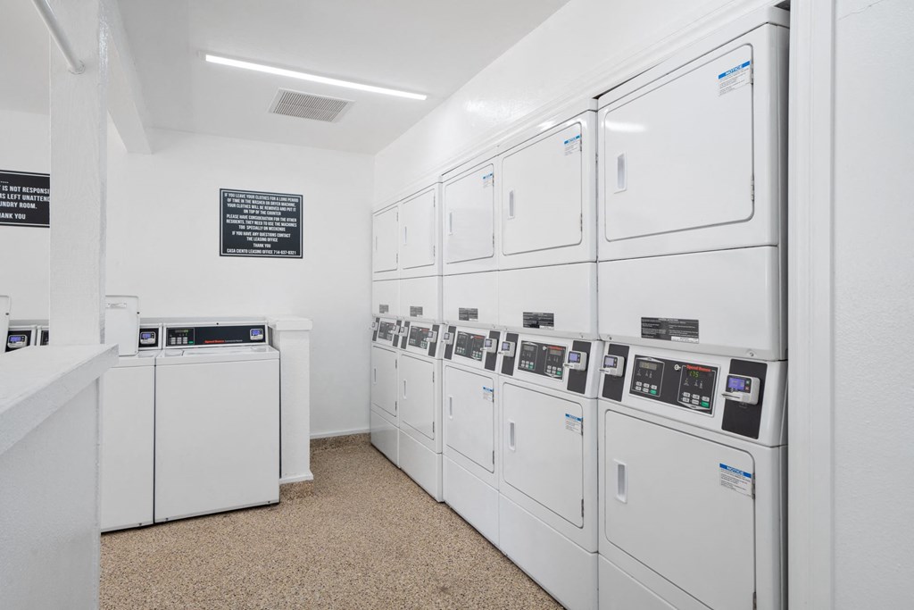 the laundry room is equipped with washer and dryer machines