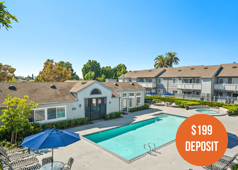 our apartments have a swimming pool and patio with umbrellas