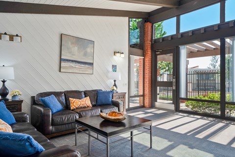 a living room with couches and a coffee table