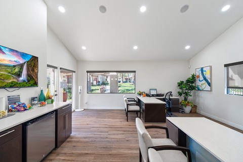 a living room with a kitchen and a dining room