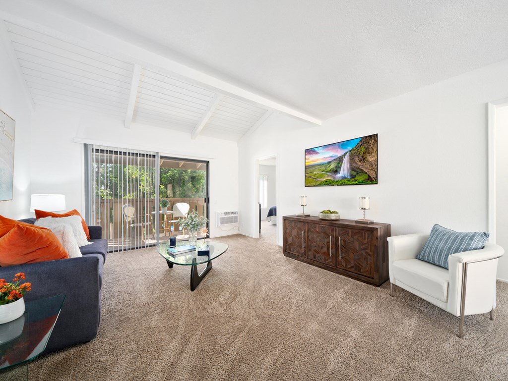 a living room with a couch and a chair
