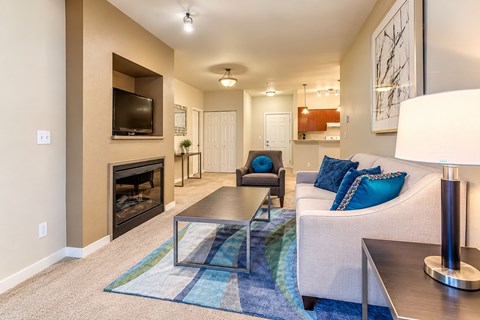 A living room with a fireplace and a couch.