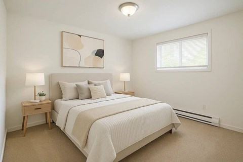 A bedroom with a large bed and a painting on the wall.