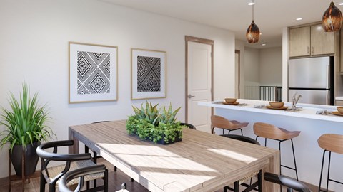 A modern dining area with a wooden table and chairs.