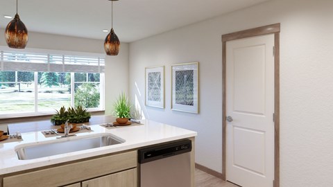 A kitchen with a white counter top and a white sink.