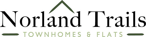 The image is a logo for Norland Trails Townhomes and Flats.