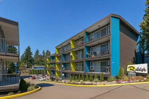A Raleigh apartment complex with a blue and yellow building.