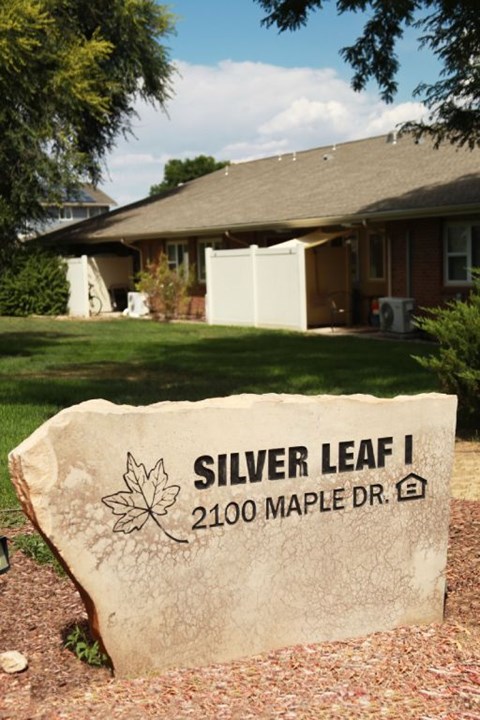 A stone sign with a leaf design on it that says Silver Leaf 1.