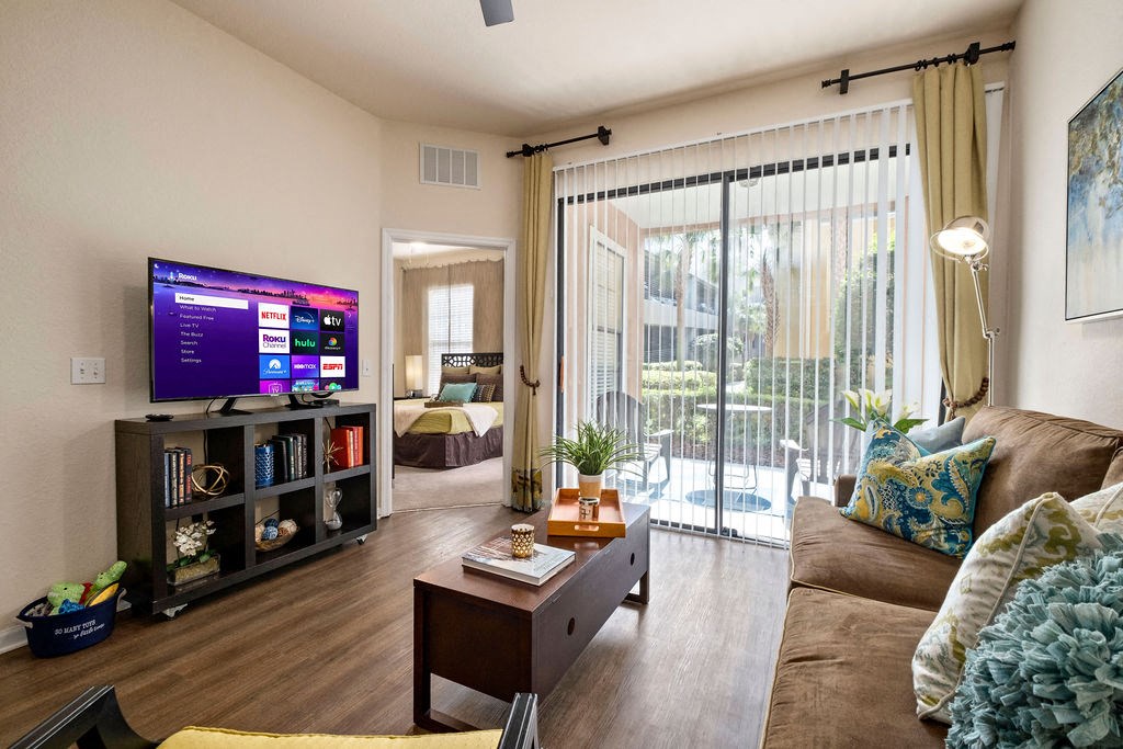 a living room with a couch and a tv