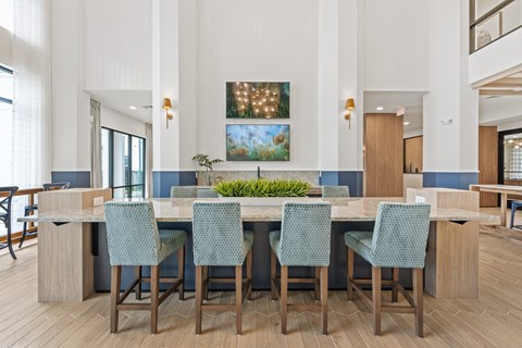 A community kitchen with a long table and chairs.