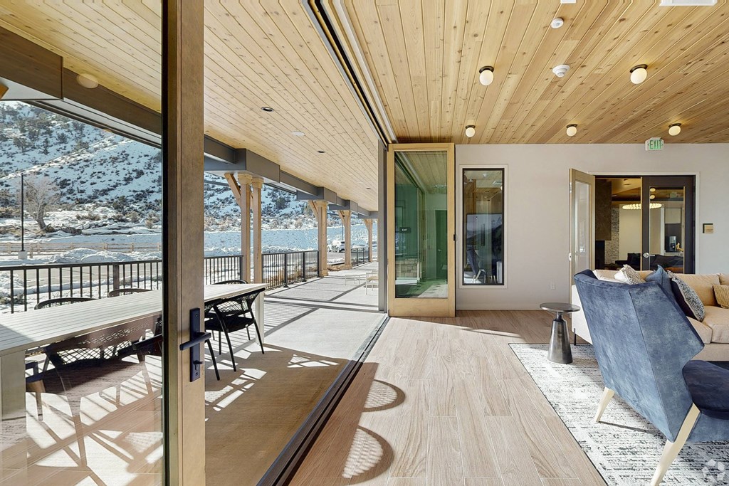 A modern living room with a view of the mountains.