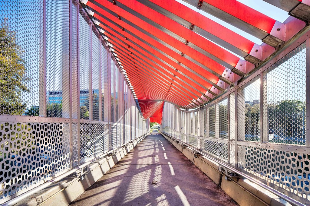 a bridge with an orange and white bridge