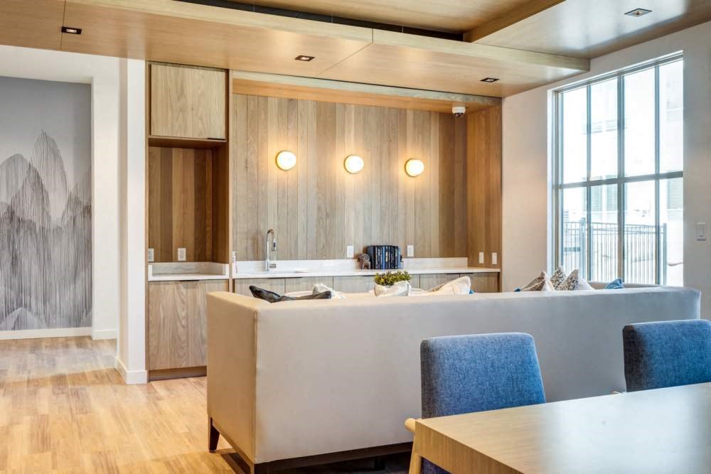 a kitchen and living room with a table and chairs