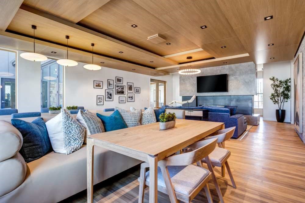 a living room and dining room in a modern apartment