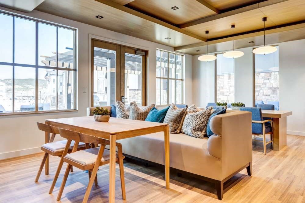 a living room with a couch and a wooden table