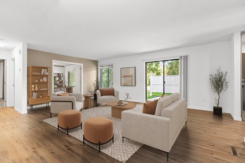 A living room with a white couch and a coffee table.