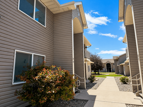 A row of houses with a clear blue sky above.