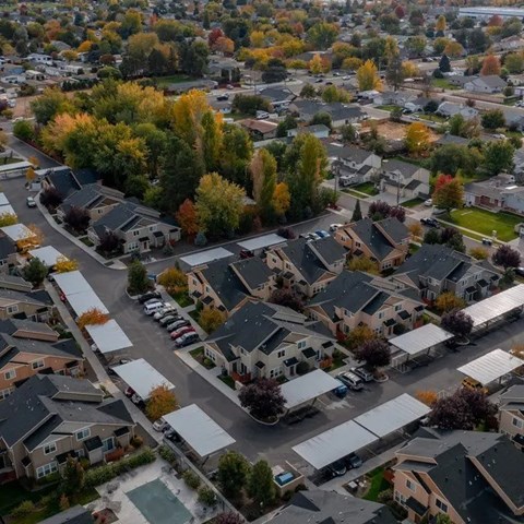 A suburban neighborhood with houses and trees.