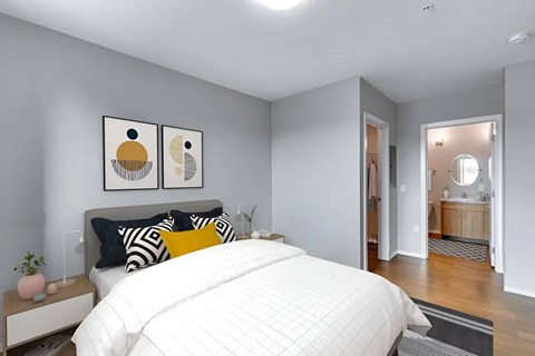 A bedroom with a large bed and two artworks on the wall.