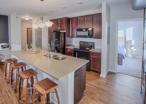 A kitchen with wooden cabinets and a white countertop.